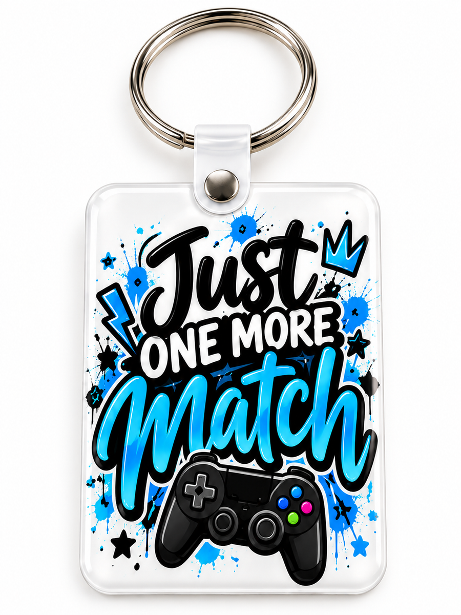 Just One More Match Keychain novelty keychain mockup featuring gaming-themed lettering, product view 1