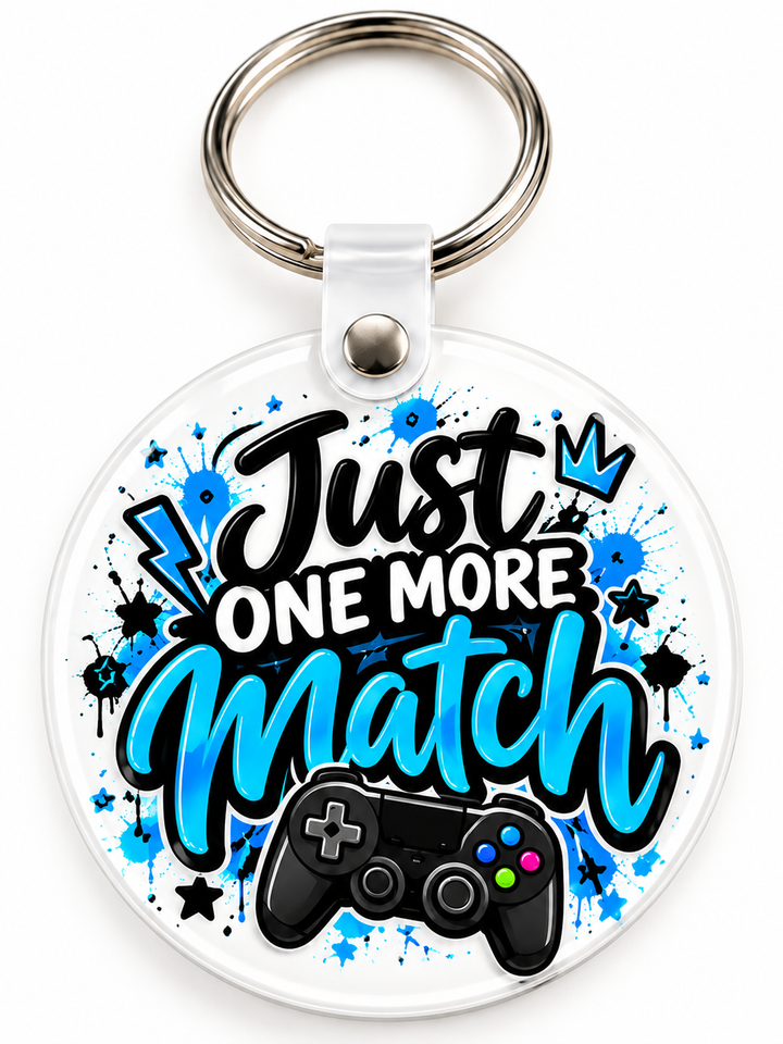 Just One More Match Keychain novelty keychain mockup featuring gaming-themed lettering, product view 3